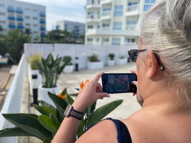Me taking a picture of Laura, taking a picture of the bird of paradise.